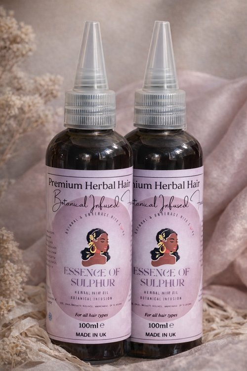Two bottles of Premium Herbal Hair Essence of Sulphur on a soft background